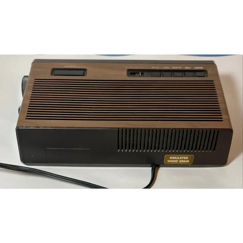 Vintage Lloyds Model J274A Clock Radio Simulated Wood Grain Plastic- clock only